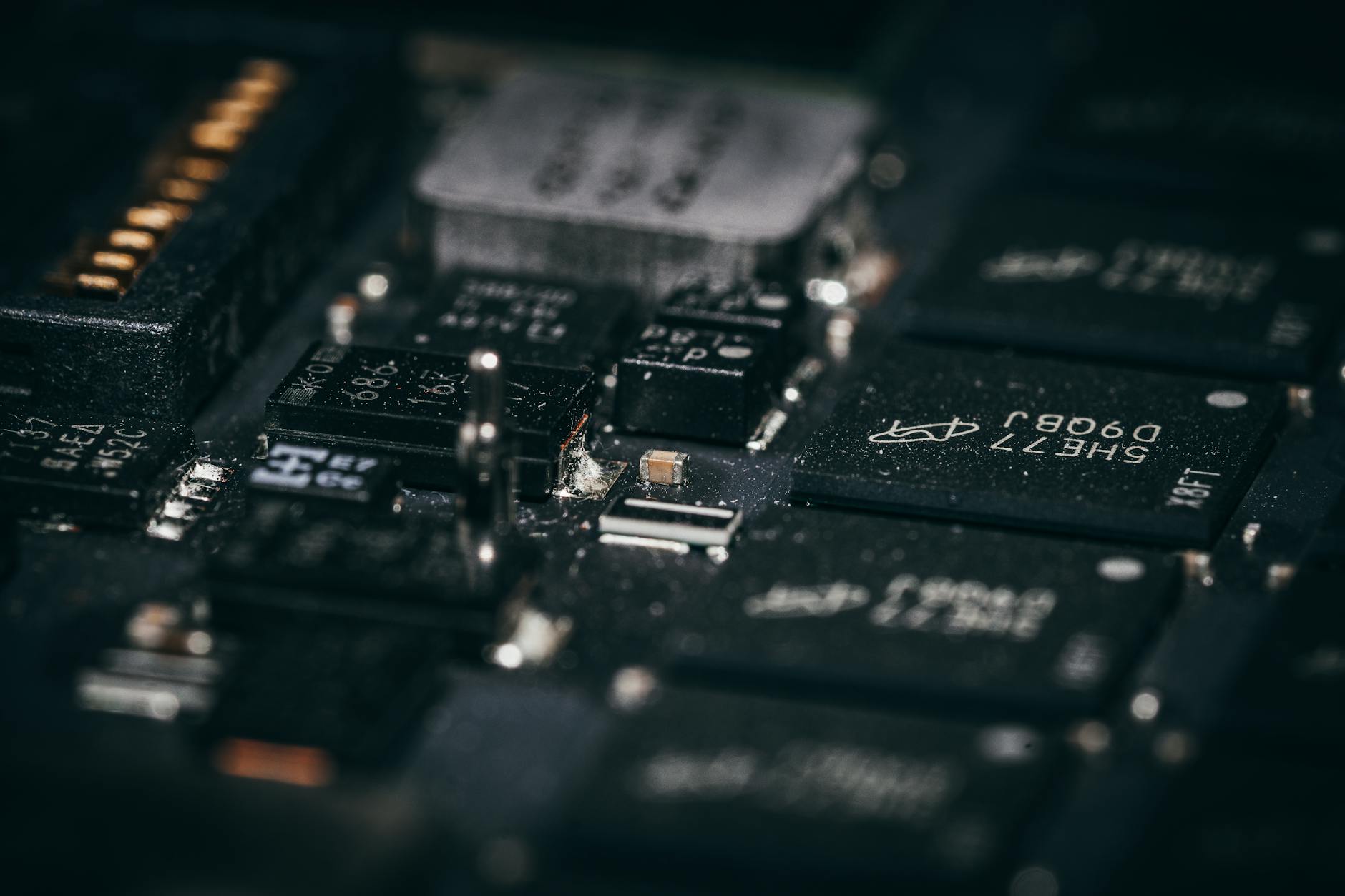 Detailed macro shot of electronic circuit components showcasing intricate design and layout.